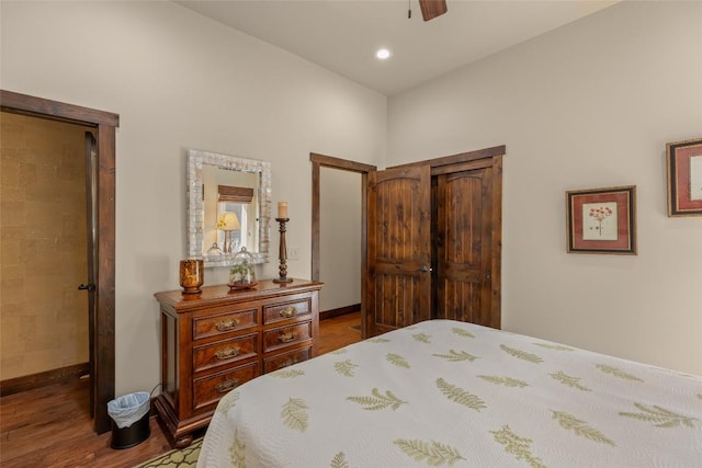 bedroom with recessed lighting, baseboards, wood finished floors, and a ceiling fan