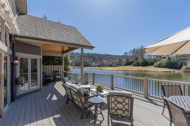 wooden deck with a water view