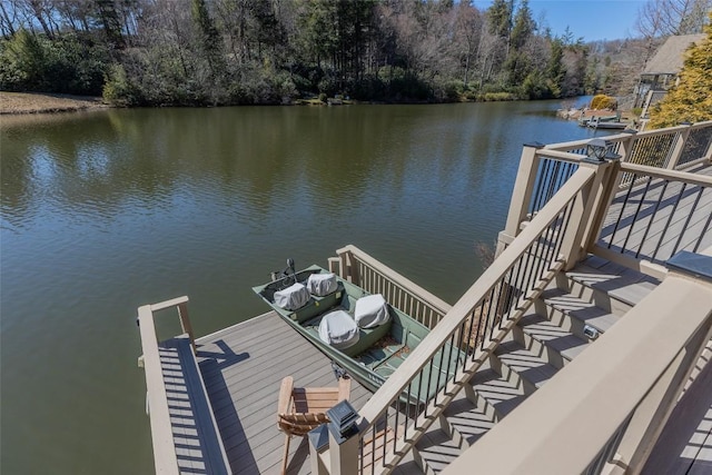 view of dock featuring stairway and a water view