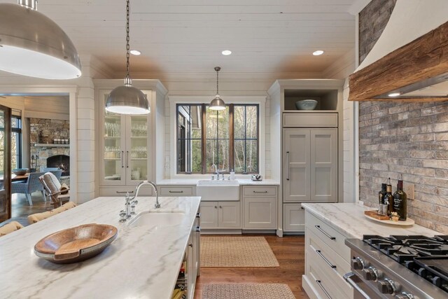 542 Cross Creek Trl, Cullowhee, NC 28723 - kitchen featuring a sink, wall chimney exhaust hood, dark wood finished floors, wood ceiling, and healthy amount of natural light