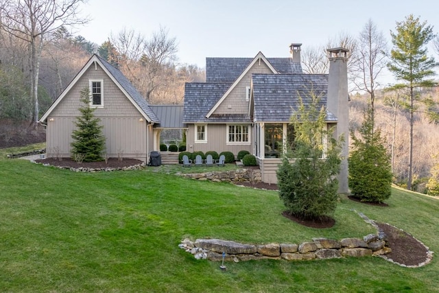 542 Cross Creek Trl, Cullowhee, NC 28723 - back of property featuring a chimney, a yard, a standing seam roof, and metal roof