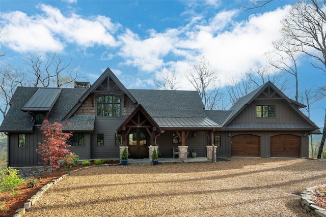 craftsman-style home featuring a garage, a standing seam roof, a shingled roof, board and batten siding, and a porch