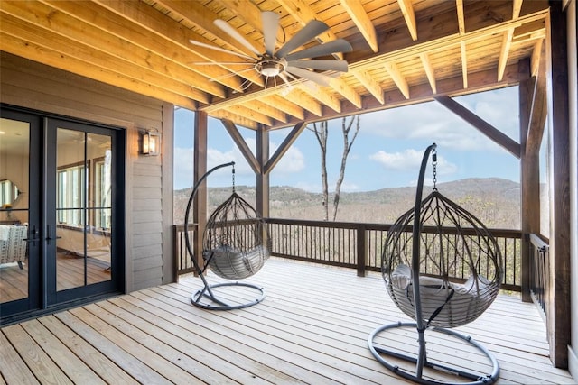 wooden deck featuring a mountain view