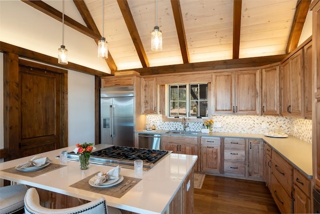 kitchen featuring a sink, stainless steel appliances, decorative backsplash, vaulted ceiling with beams, and a kitchen island