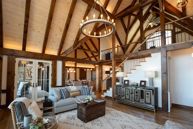 living area with high vaulted ceiling, french doors, stairs, and a chandelier