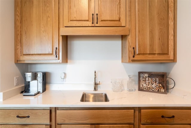 kitchen with a sink and light countertops
