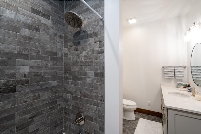 full bathroom featuring vanity, baseboards, and toilet