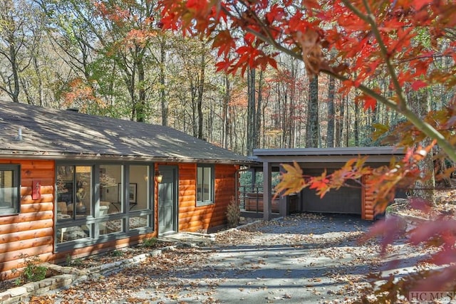 log home featuring a garage