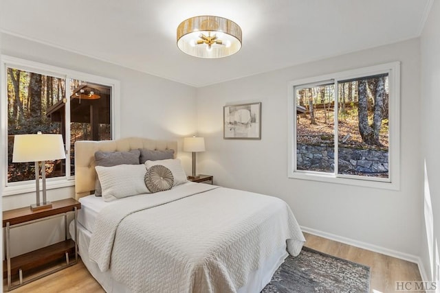 bedroom with light hardwood / wood-style flooring