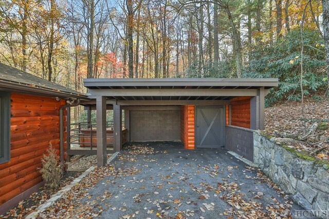 garage featuring a carport