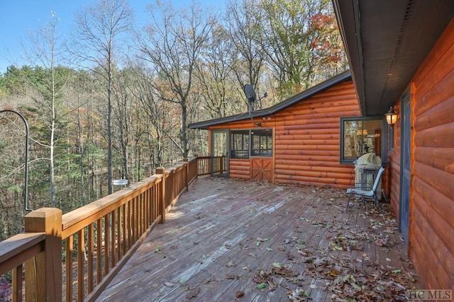 wooden deck featuring area for grilling