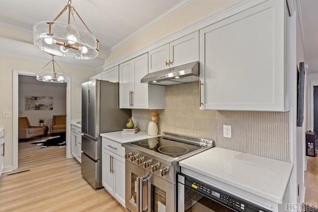 kitchen with stainless steel appliances, ornamental molding, hanging light fixtures, and white cabinets