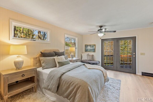 bedroom featuring access to exterior, crown molding, light hardwood / wood-style floors, and ceiling fan