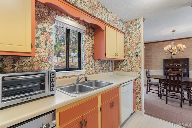 kitchen featuring sink, a chandelier, a textured ceiling, stainless steel dishwasher, and white dishwasher