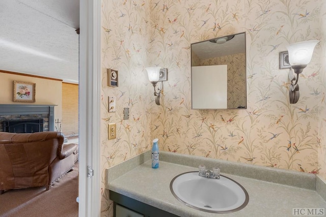 bathroom with vanity and a fireplace