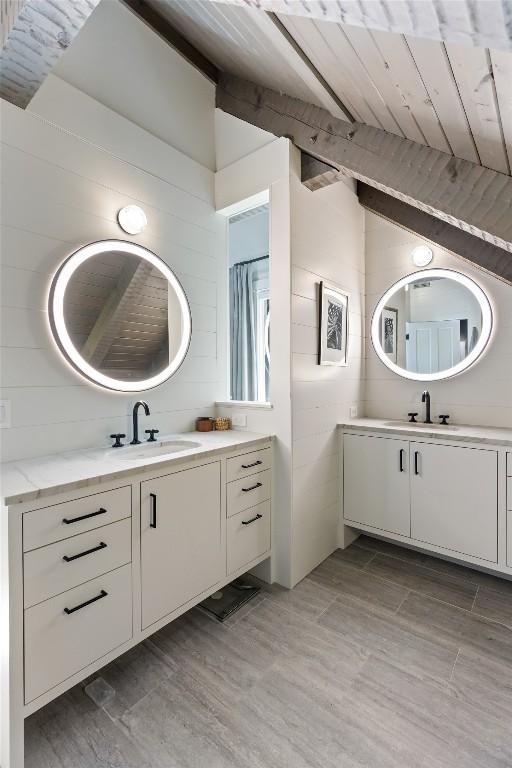 42 W Black Rock Cir, Highlands, NC 28741 - full bath with two vanities, wood finished floors, and wood ceiling