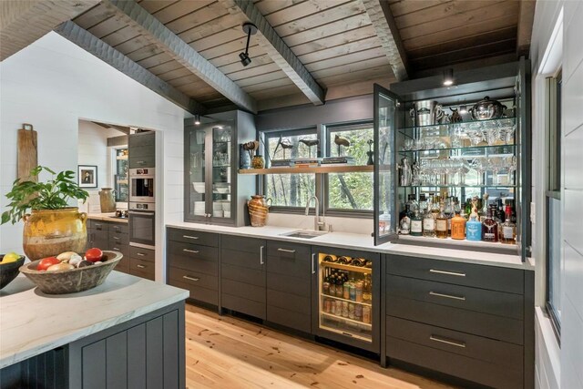 42 W Black Rock Cir, Highlands, NC 28741 - indoor wet bar with wooden ceiling, light wood-style floors, wine cooler, and stainless steel double oven