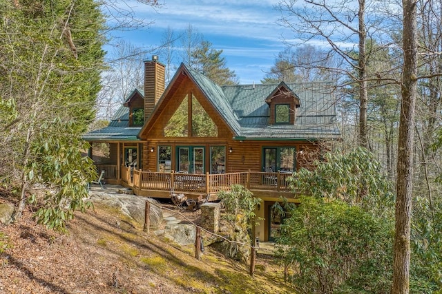 rear view of house with a wooden deck