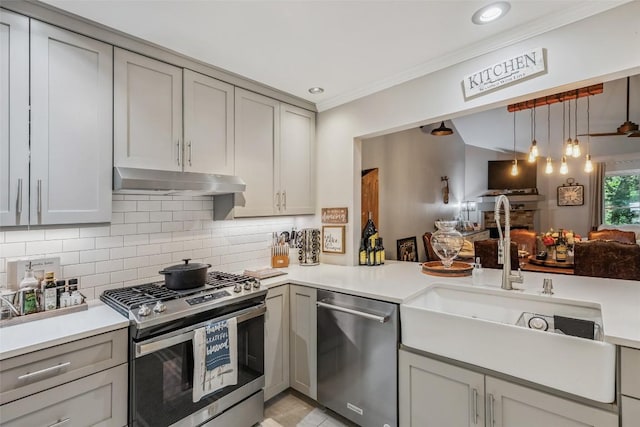 27 Dwarf Mountain Rd Unit 23Un, Sapphire, NC 28774 - kitchen featuring stainless steel appliances, under cabinet range hood, light countertops, decorative backsplash, and crown molding