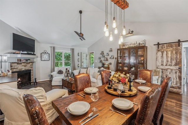 27 Dwarf Mountain Rd Unit 23Un, Sapphire, NC 28774 - dining room with vaulted ceiling, wood finished floors, a fireplace, and a barn door