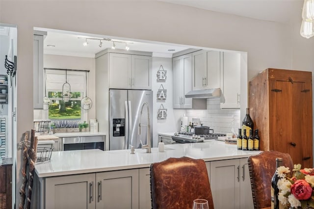27 Dwarf Mountain Rd Unit 23Un, Sapphire, NC 28774 - kitchen with stainless steel refrigerator with ice dispenser, gray cabinets, under cabinet range hood, decorative backsplash, and a peninsula
