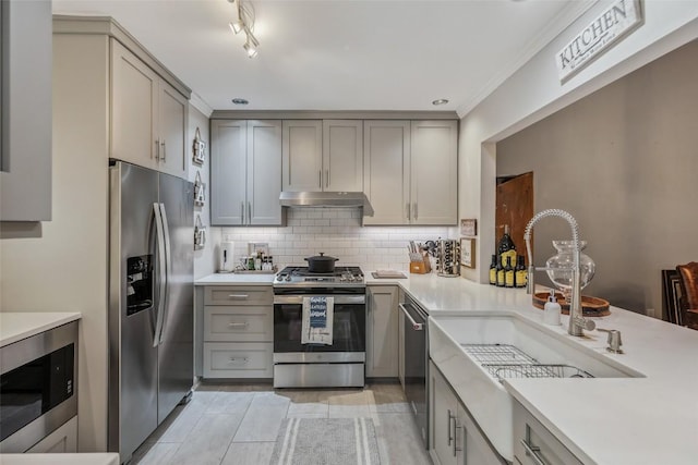 27 Dwarf Mountain Rd Unit 23Un, Sapphire, NC 28774 - kitchen with stainless steel appliances, under cabinet range hood, gray cabinetry, light countertops, and tasteful backsplash