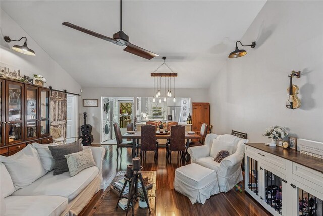 27 Dwarf Mountain Rd Unit 23Un, Sapphire, NC 28774 - living room featuring stacked washer and clothes dryer, vaulted ceiling, and wood finished floors