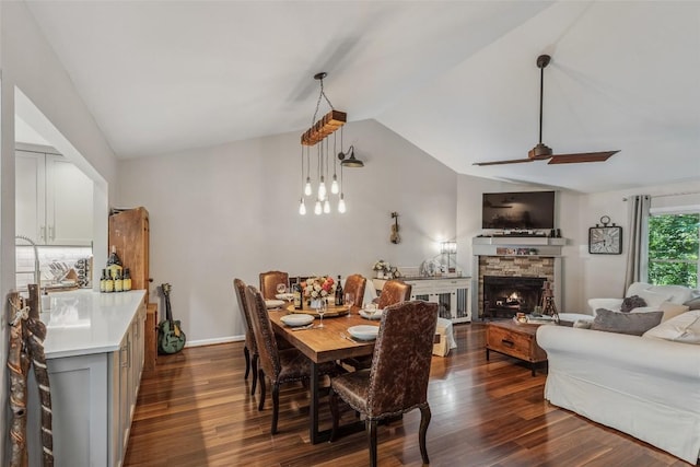 27 Dwarf Mountain Rd Unit 23Un, Sapphire, NC 28774 - dining room featuring vaulted ceiling, dark wood finished floors, a ceiling fan, and a stone fireplace