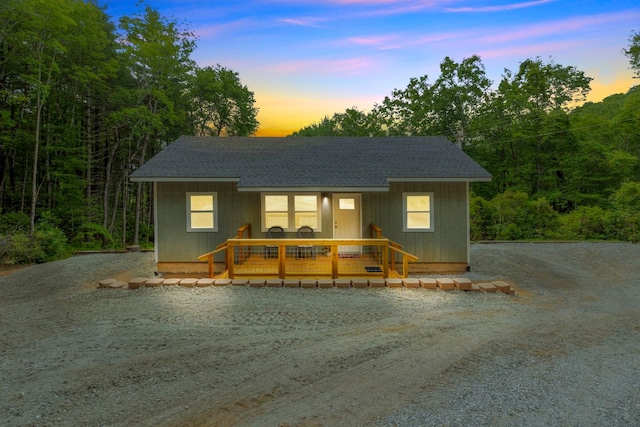 185 Little Elbow Mountain Rd, Lake Toxaway, NC 28747 - chalet / cabin featuring roof with shingles, gravel driveway, and a porch