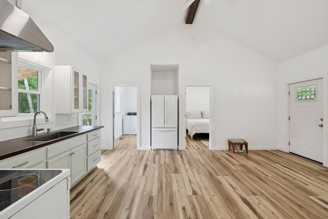 185 Little Elbow Mountain Rd, Lake Toxaway, NC 28747 - kitchen with white appliances, wall chimney exhaust hood, dark countertops, white cabinetry, and beam ceiling