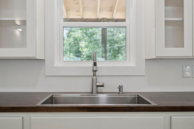185 Little Elbow Mountain Rd, Lake Toxaway, NC 28747 - kitchen featuring white cabinets, glass insert cabinets, and butcher block countertops