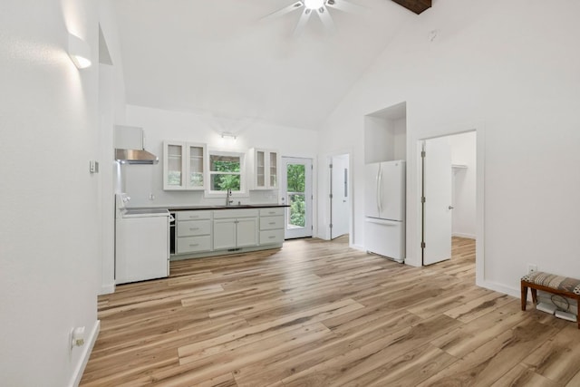 185 Little Elbow Mountain Rd, Lake Toxaway, NC 28747 - kitchen featuring stove, freestanding refrigerator, high vaulted ceiling, a ceiling fan, and light wood-type flooring