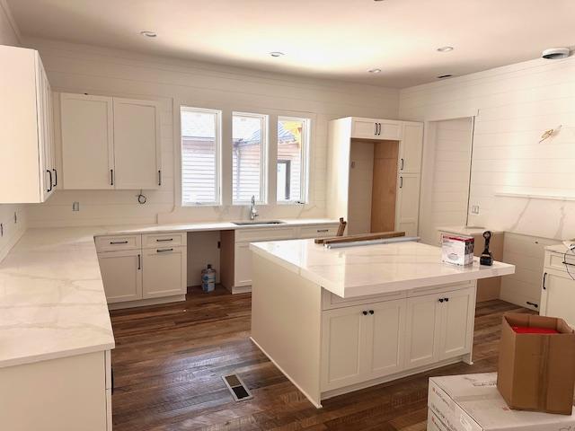 298 Pine Forest Rd, Sapphire, NC 28774 - kitchen featuring white cabinets, a kitchen island, and dark wood-type flooring