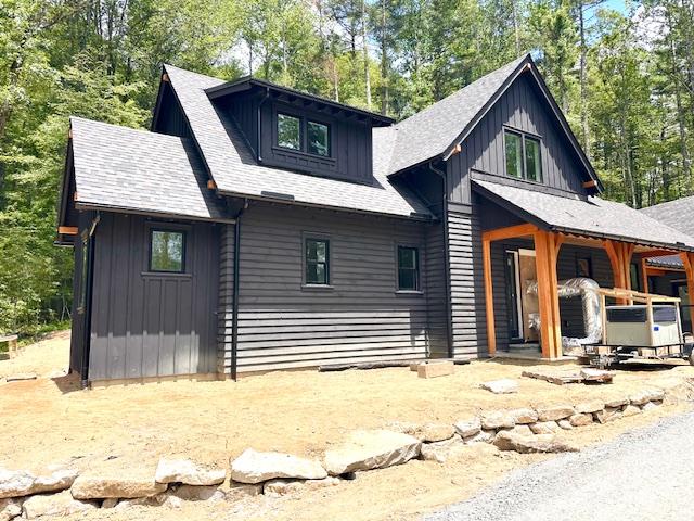 298 Pine Forest Rd, Sapphire, NC 28774 - view of front of house featuring board and batten siding and roof with shingles