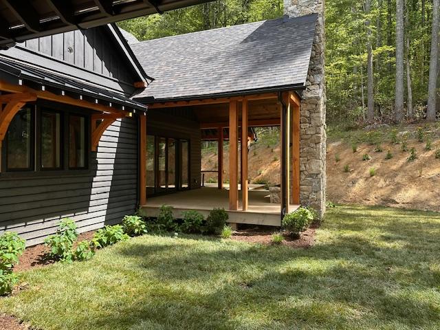 298 Pine Forest Rd, Sapphire, NC 28774 - doorway to property with a chimney, a yard, roof with shingles, and board and batten siding