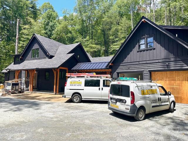 298 Pine Forest Rd, Sapphire, NC 28774 - view of front facade featuring board and batten siding and a garage
