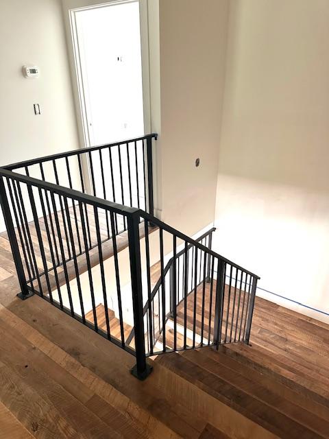 298 Pine Forest Rd, Sapphire, NC 28774 - stairway featuring wood finished floors and baseboards