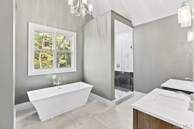 bathroom featuring vanity, shower with separate bathtub, and a chandelier