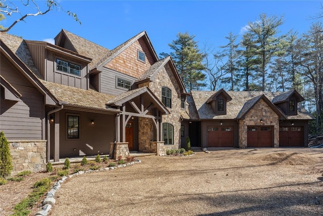 343 Ledgeview Rd, Cashiers, NC 28717 - view of front of property with stone siding, a garage, board and batten siding, and a porch