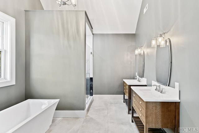 bathroom featuring vanity and shower with separate bathtub