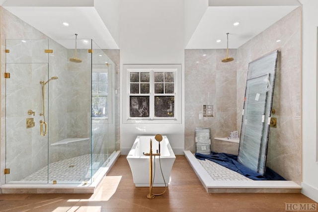 bathroom with shower with separate bathtub