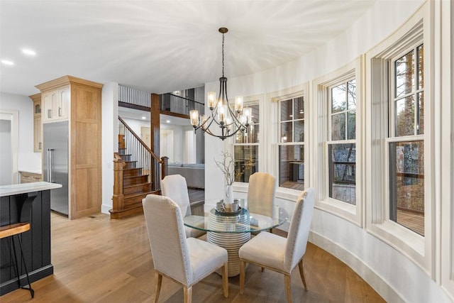 343 Ledgeview Rd, Cashiers, NC 28717 - dining area with a chandelier, light wood-type flooring, stairway, and recessed lighting