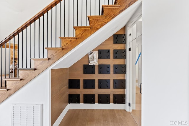 stairs with wood-type flooring