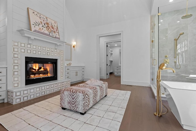 343 Ledgeview Rd, Cashiers, NC 28717 - living area featuring wood finished floors, a brick fireplace, baseboards, and a towering ceiling