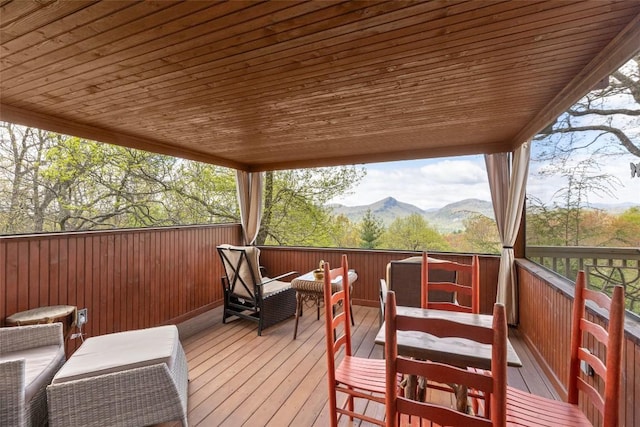 wooden terrace with a mountain view