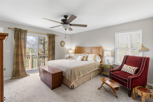 bedroom featuring access to outside, a ceiling fan, and light colored carpet