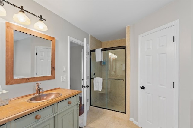 bathroom with a shower stall, french doors, tile patterned flooring, and vanity