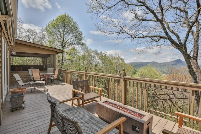 view of mountain feature with a view of trees