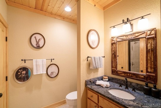 bathroom with toilet, vanity, and wooden ceiling