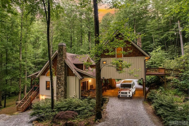 view of front of house featuring a wooden deck and a carport